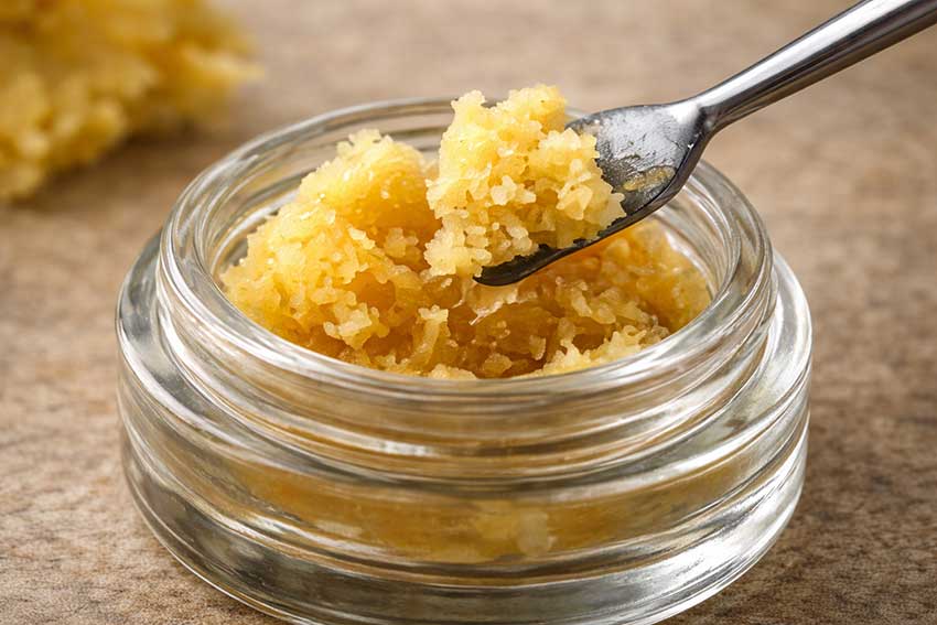 Cannabis wax and budder concentrate in a glass jar at Huff and Puff Dispensary