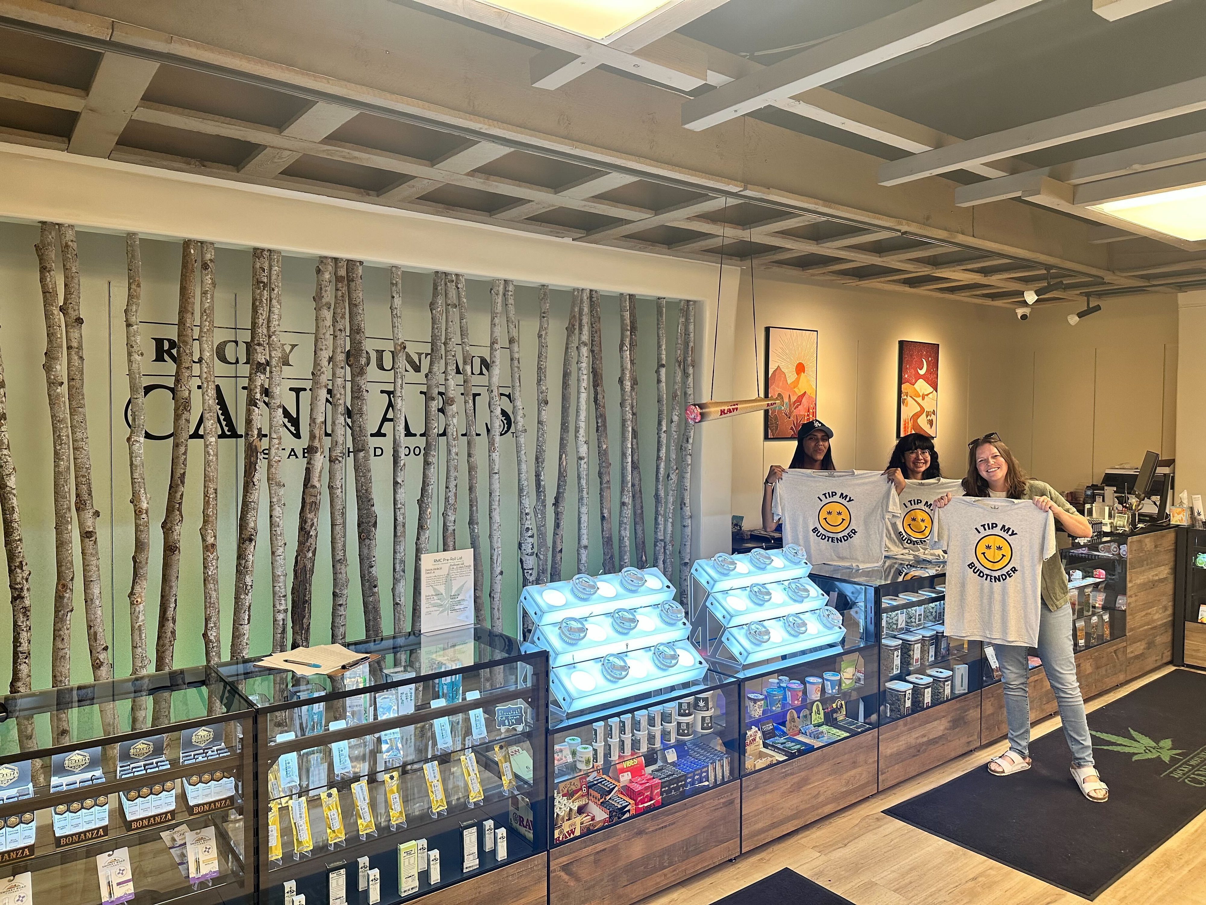 Budtender helping first-time customer at Huff and Puff Dispensary Vadnais Heights